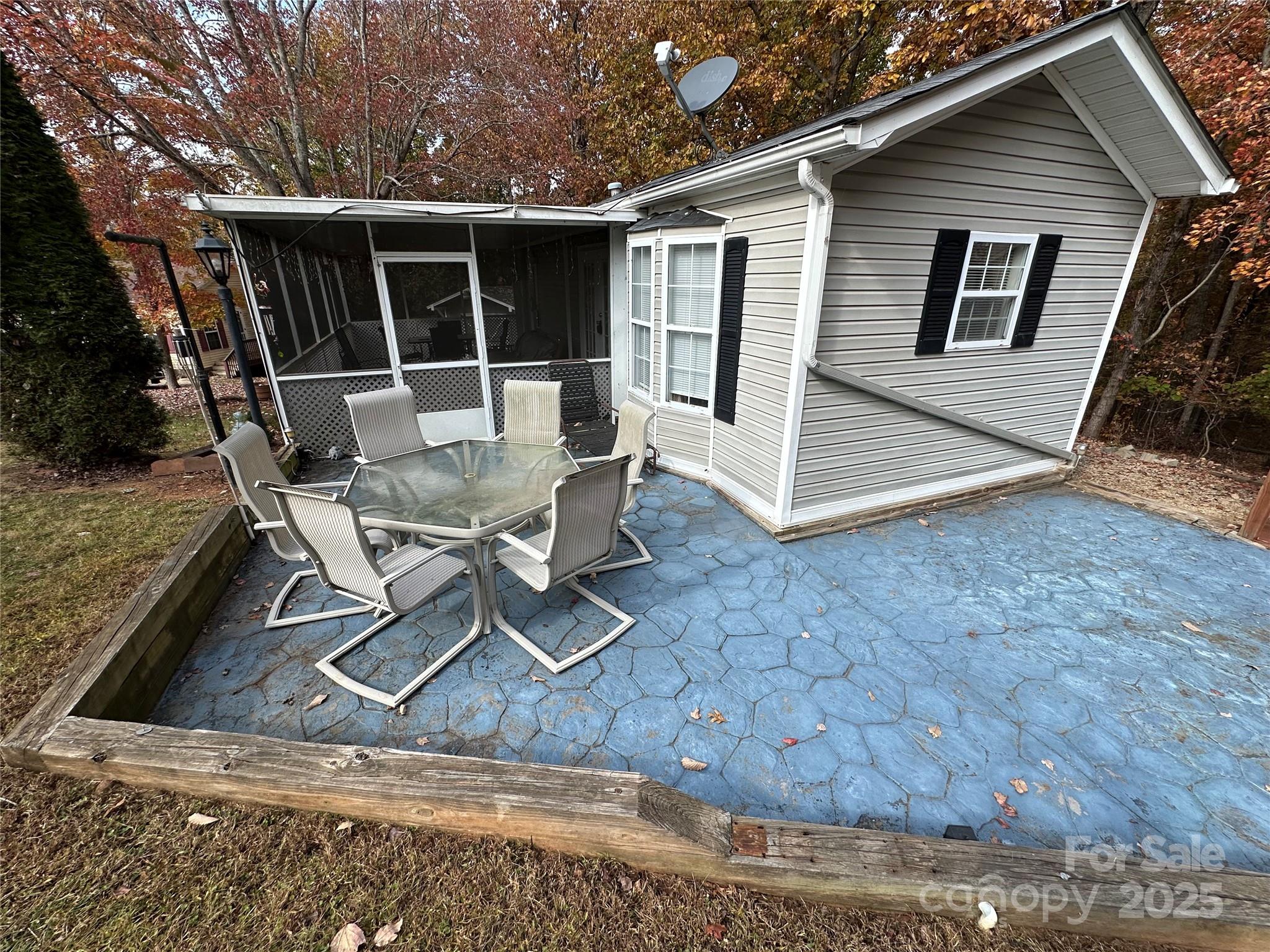 124 Hummingbird Circle New London, NC 28127 - Photo 20 of 48 a view of backyard with deck and outdoor seating