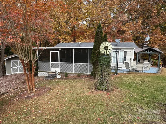 a front view of a house with a garden and yard