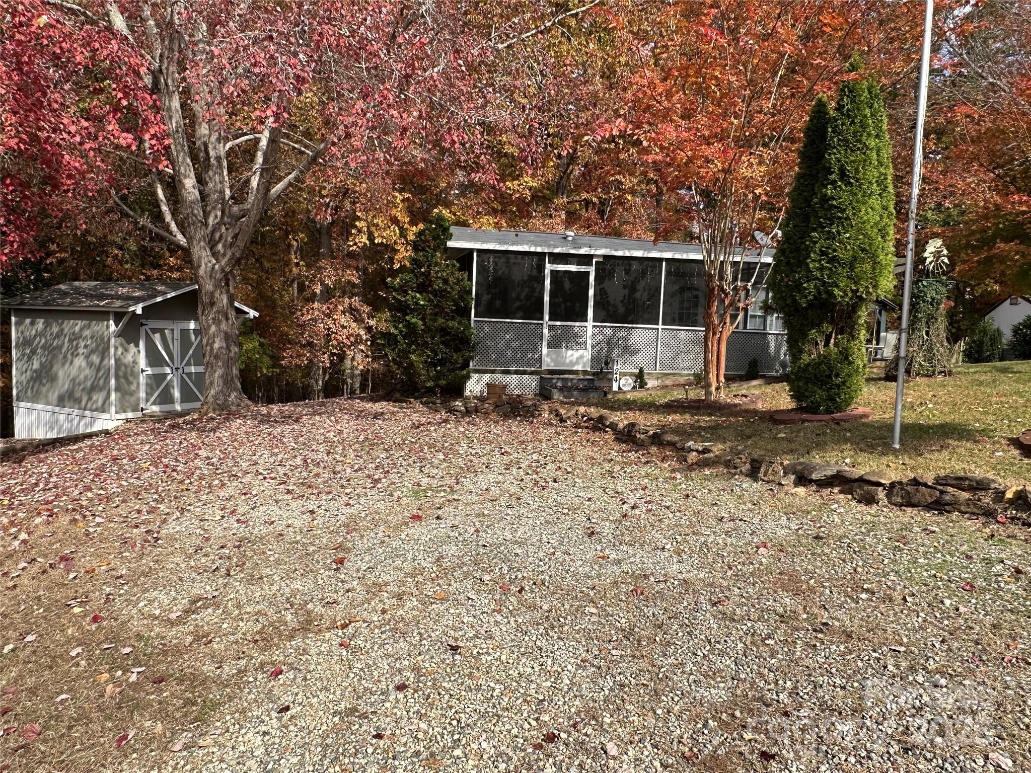 124 Hummingbird Circle New London, NC 28127 - Photo 27 of 48 a front view of a house with a yard