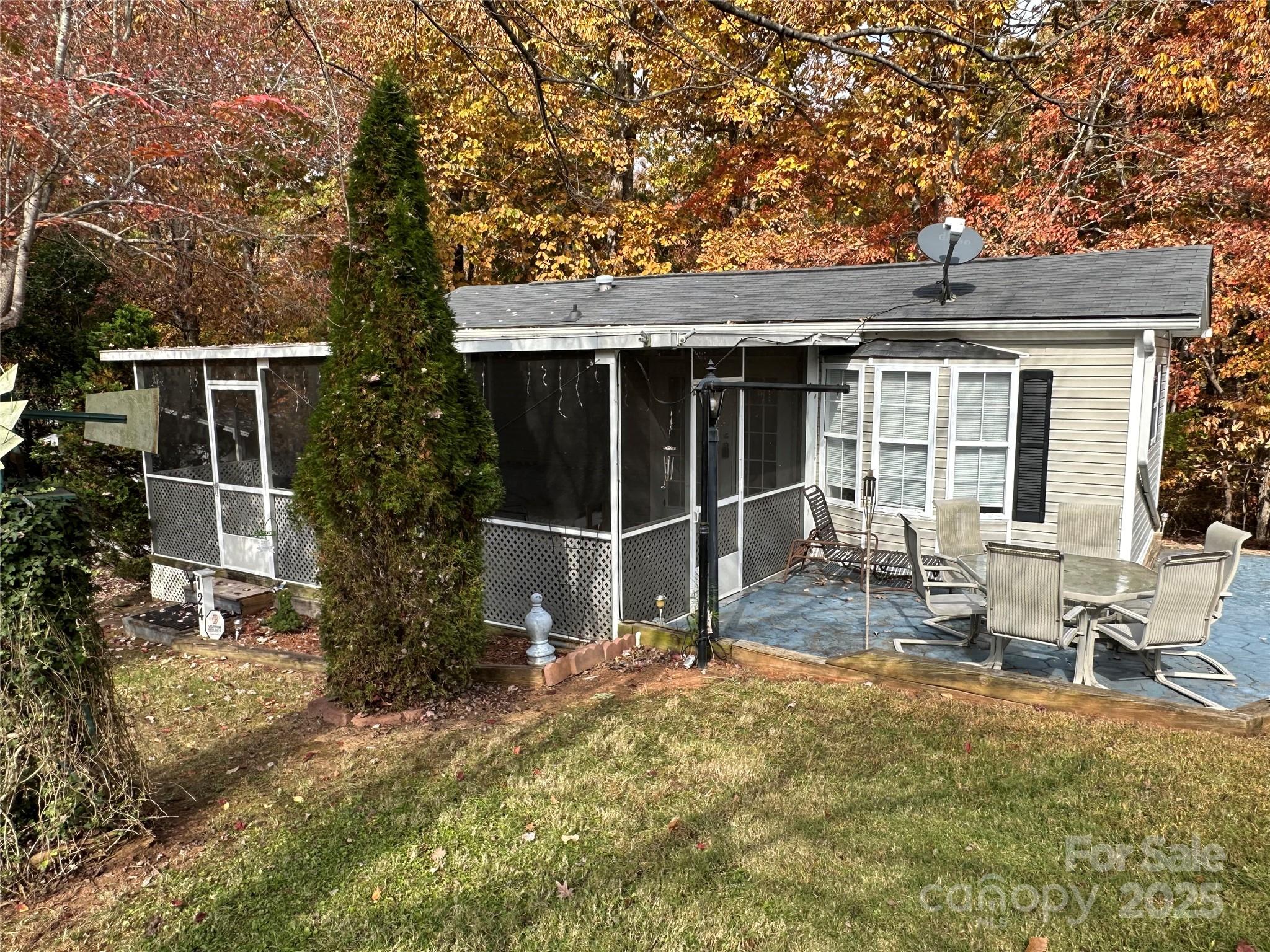 124 Hummingbird Circle New London, NC 28127 - Photo 28 of 48 a view of house with backyard space and garden