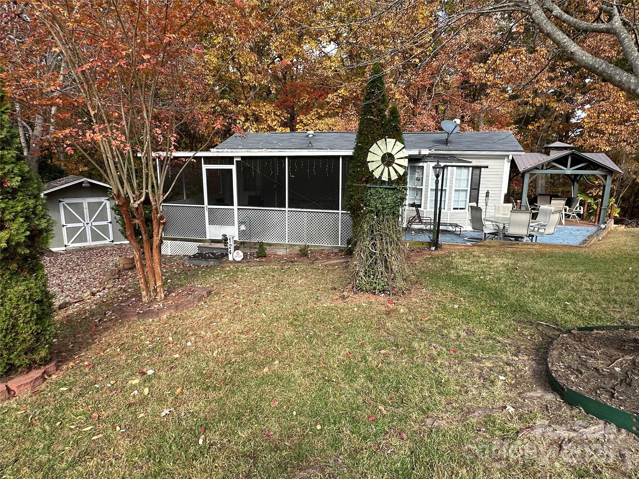 124 Hummingbird Circle New London, NC 28127 - Photo 29 of 48 a front view of a house with garden