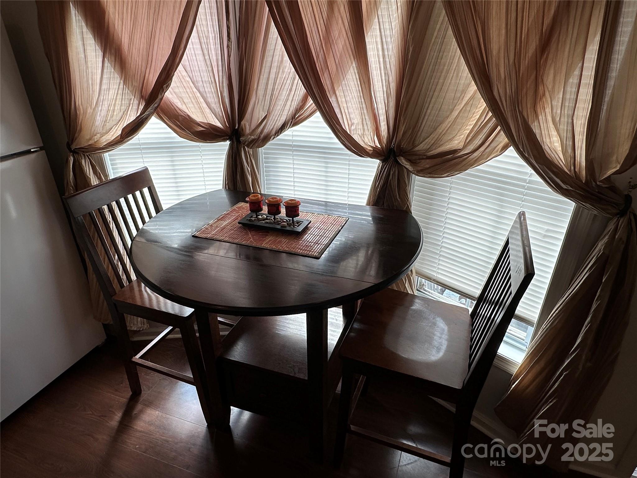 124 Hummingbird Circle New London, NC 28127 - Photo 6 of 48 a backyard of a house with table and chairs