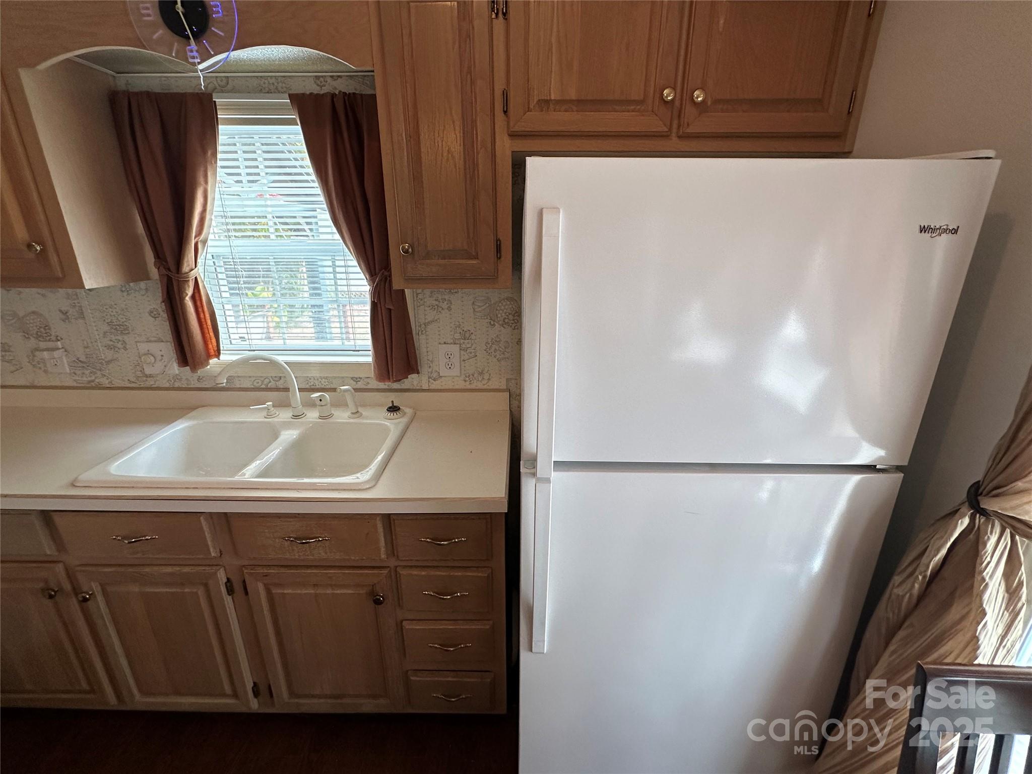124 Hummingbird Circle New London, NC 28127 - Photo 9 of 48 a view of walk in closet with window and door