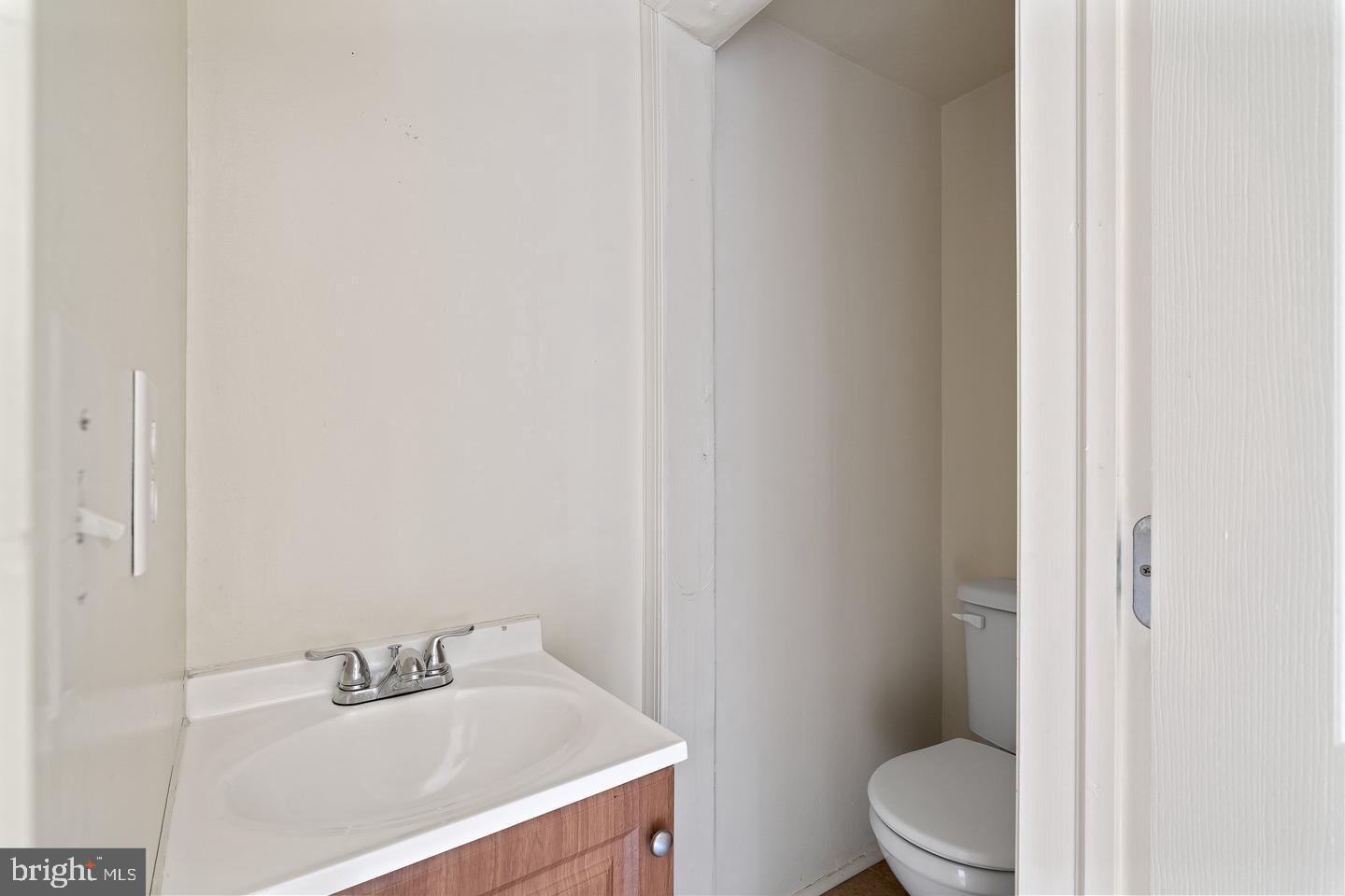 1225 South 2nd Street Philadelphia, PA 19147 - Photo 7 of 23 a bathroom with a sink a toilet and a mirror