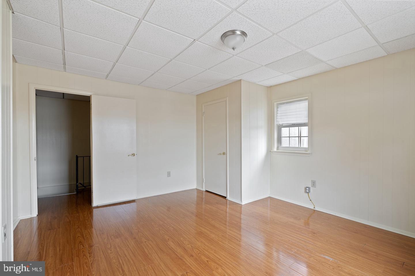 1225 South 2nd Street Philadelphia, PA 19147 - Photo 8 of 23 an empty room with wooden floor and windows