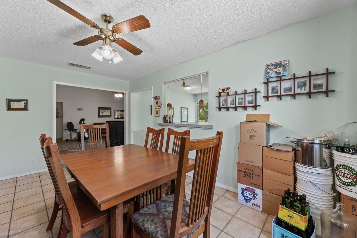 9005 Dorella Lane Austin, TX 78736 - Photo 15 of 38 a view of a dining room with furniture and wooden floor