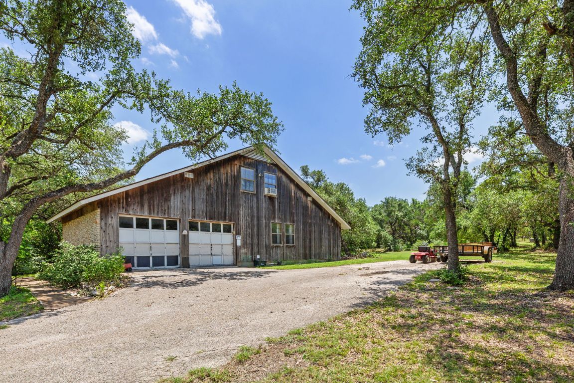 9005 Dorella Lane Austin, TX 78736 - Photo 3 of 38 a view of a house with a yard