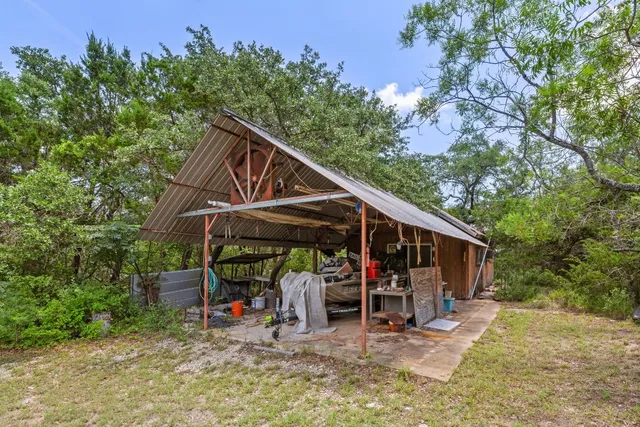 a view of outdoor space with table and chairs