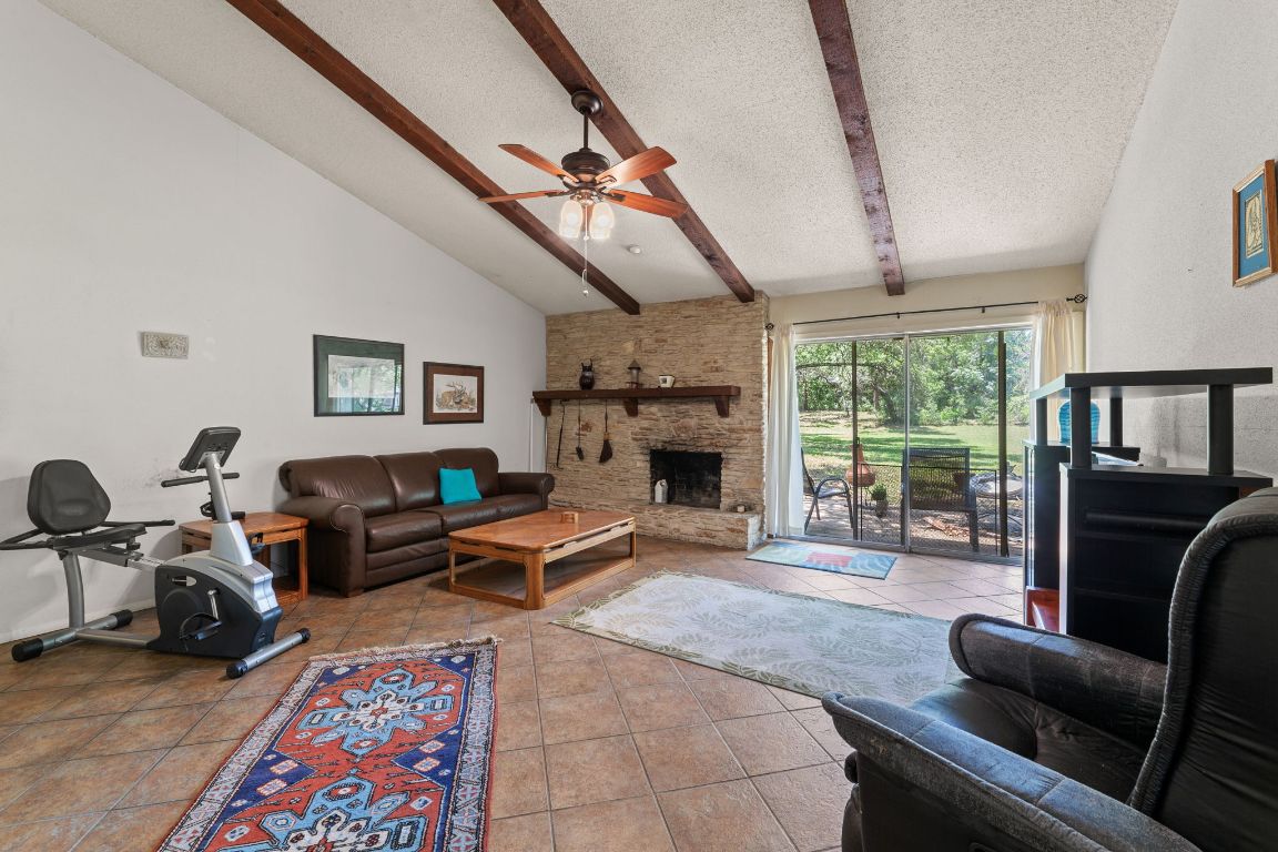 9005 Dorella Lane Austin, TX 78736 - Photo 6 of 38 a living room with furniture fireplace and a large window