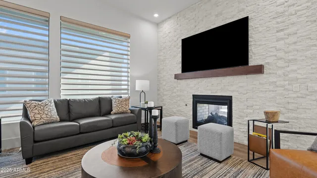 a living room with furniture fireplace and a flat screen tv