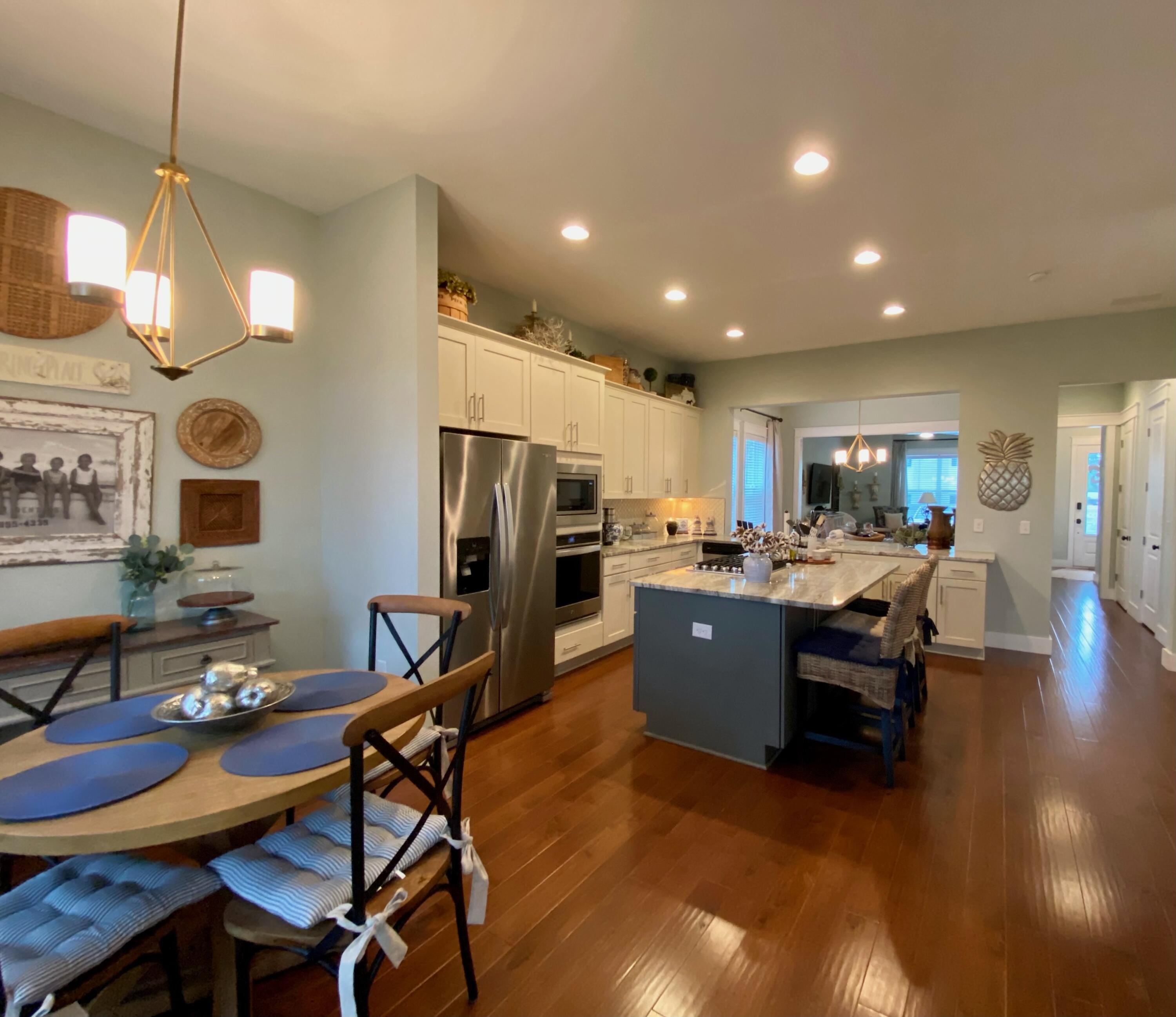 55 Valdare Way Inlet Beach Inlet Beach, FL 32461 - Photo 13 of 21 a living room with stainless steel appliances kitchen island granite countertop furniture and a dining table with kitchen view