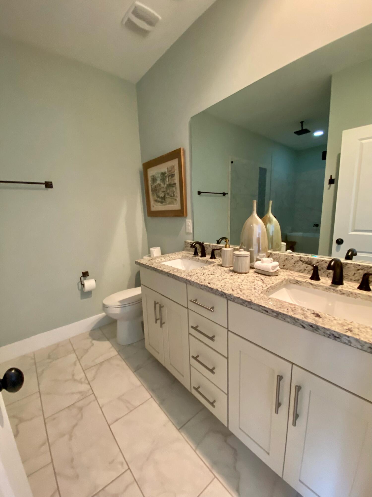 55 Valdare Way Inlet Beach Inlet Beach, FL 32461 - Photo 2 of 21 a bathroom with a granite countertop sink mirror and toilet