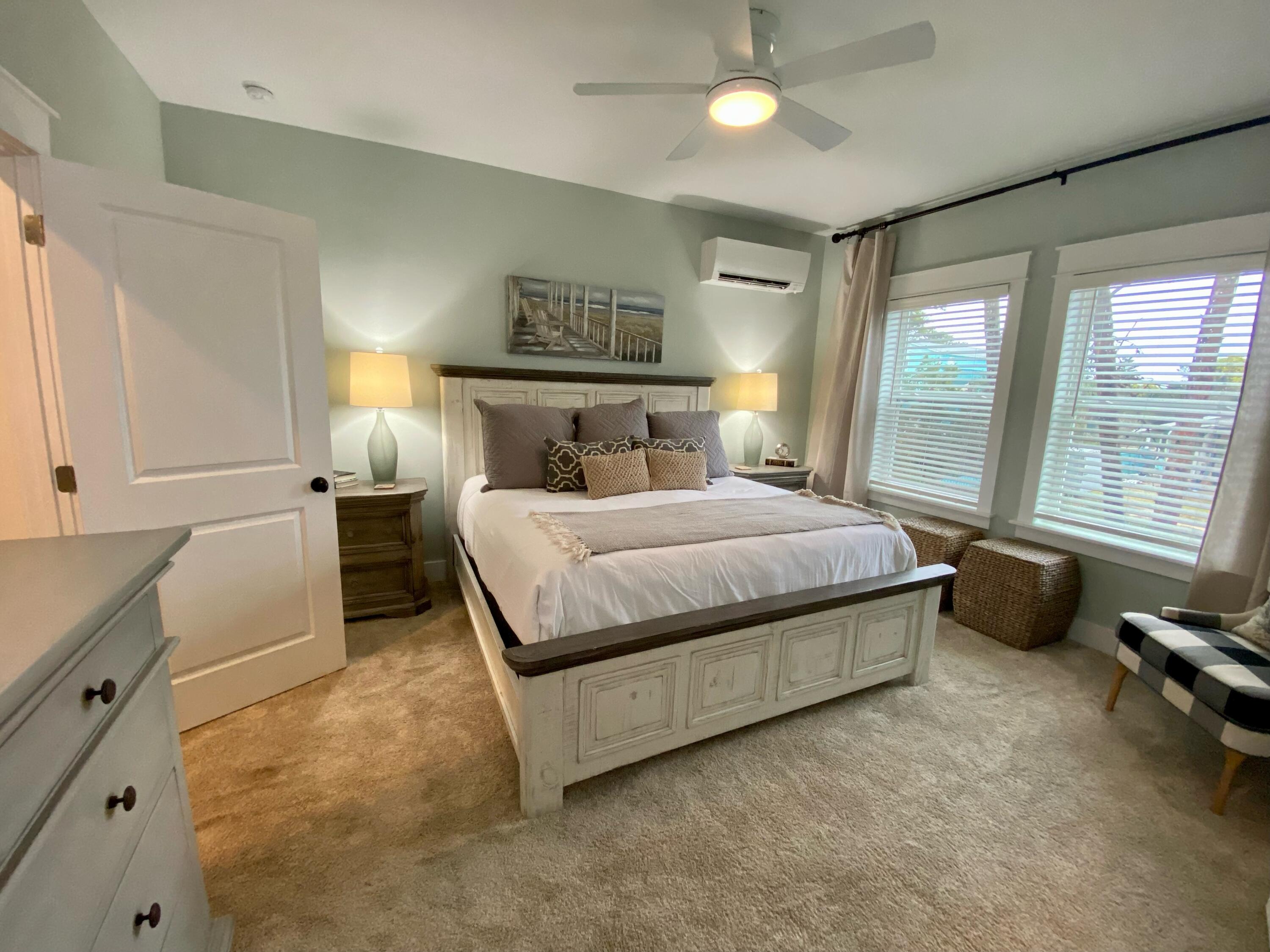 55 Valdare Way Inlet Beach Inlet Beach, FL 32461 - Photo 5 of 21 a bedroom with a bed and a large window