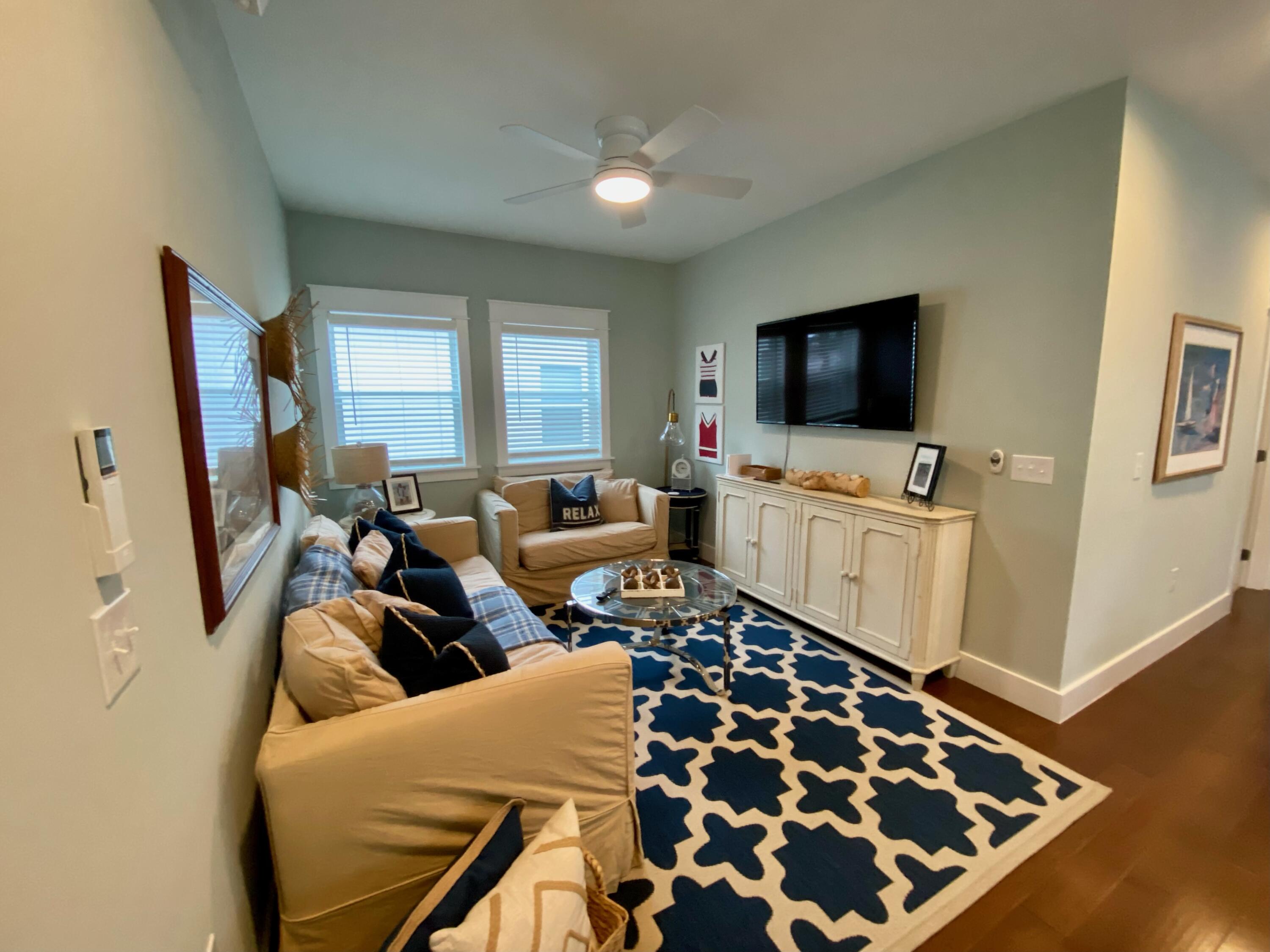 55 Valdare Way Inlet Beach Inlet Beach, FL 32461 - Photo 6 of 21 a living room with furniture and a flat screen tv