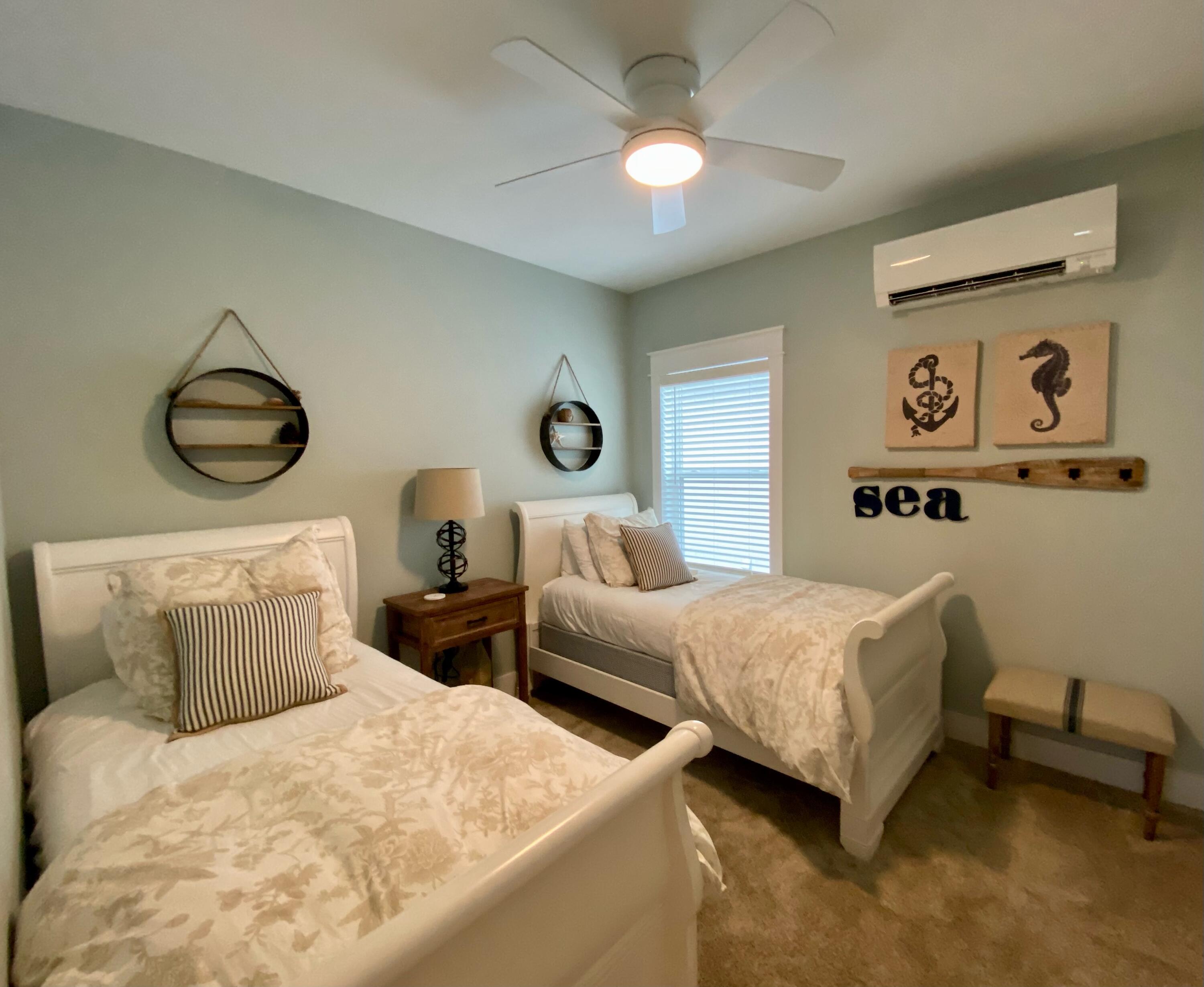 55 Valdare Way Inlet Beach Inlet Beach, FL 32461 - Photo 8 of 21 a bedroom with two beds and painting on the wall