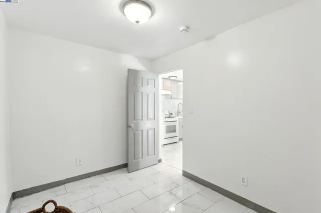 a bedroom with a bed and a mirror