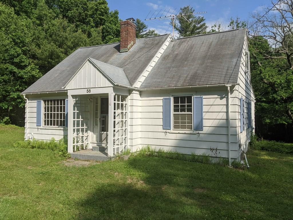 58 North Monson Road Hampden, MA 01036 - Photo 1 of 25 a front view of a house with a garden
