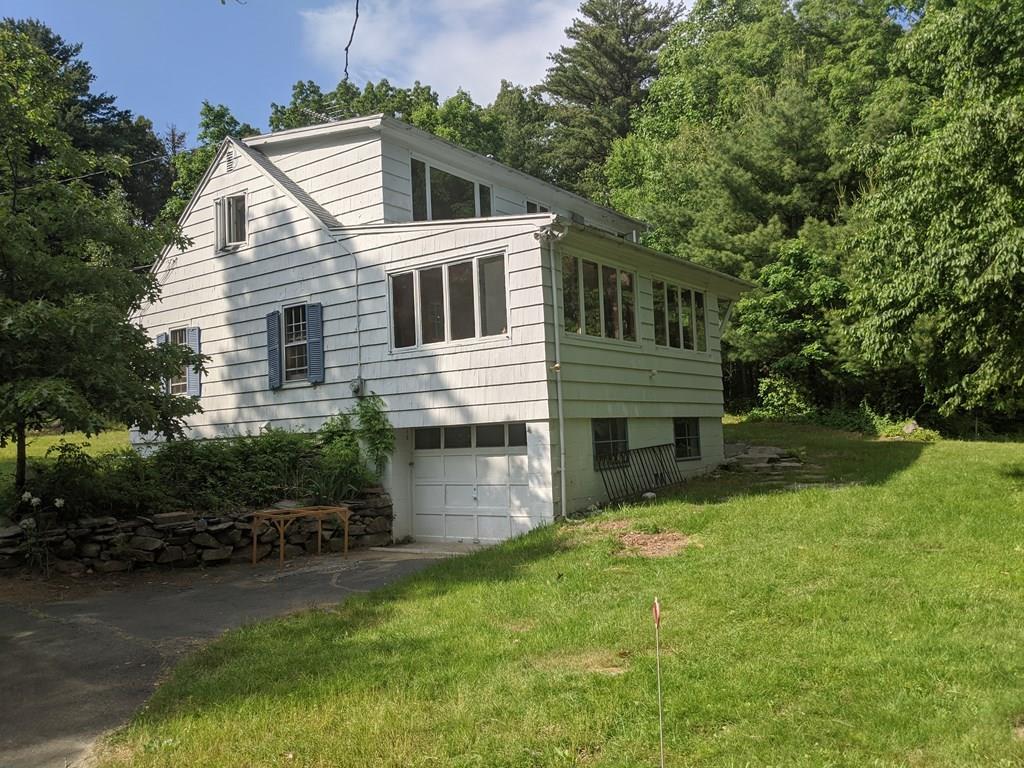 58 North Monson Road Hampden, MA 01036 - Photo 2 of 25 a front view of house with yard and green space