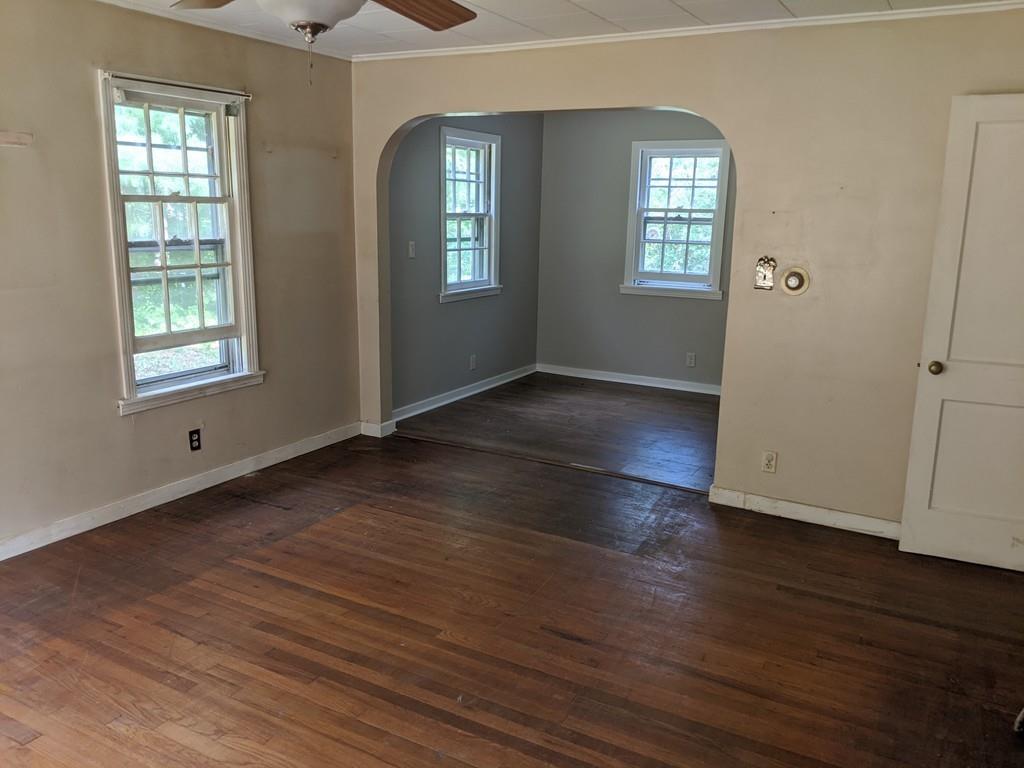 58 North Monson Road Hampden, MA 01036 - Photo 4 of 25 an empty room with wooden floor and windows