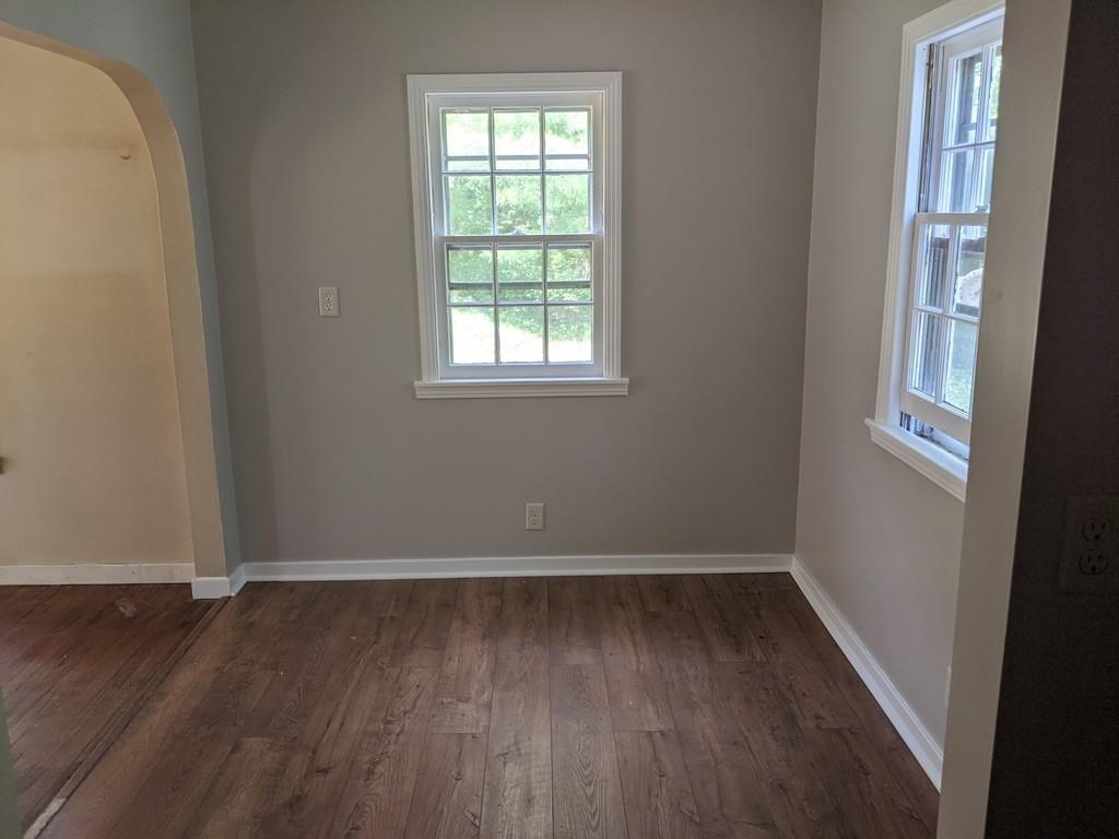 58 North Monson Road Hampden, MA 01036 - Photo 6 of 25 an empty room with wooden floor and windows