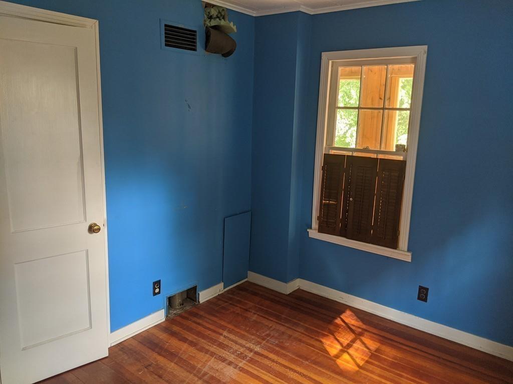 58 North Monson Road Hampden, MA 01036 - Photo 9 of 25 a view of empty room with window and wooden floor