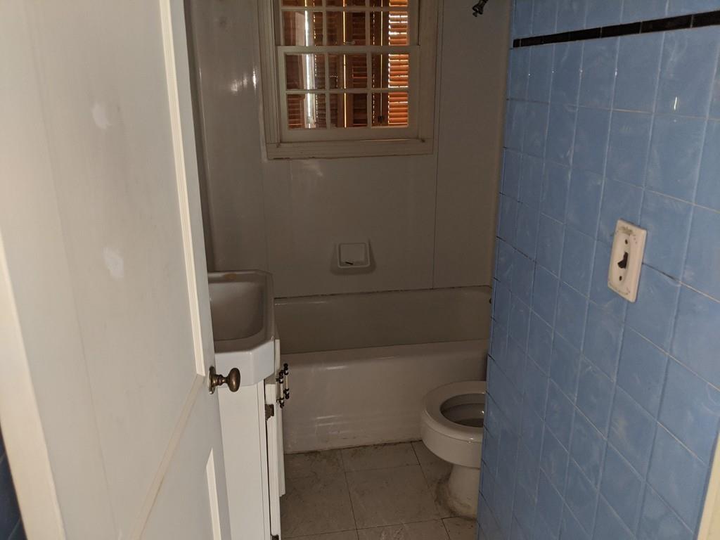 58 North Monson Road Hampden, MA 01036 - Photo 10 of 25 a bathroom with a granite countertop toilet and a shower