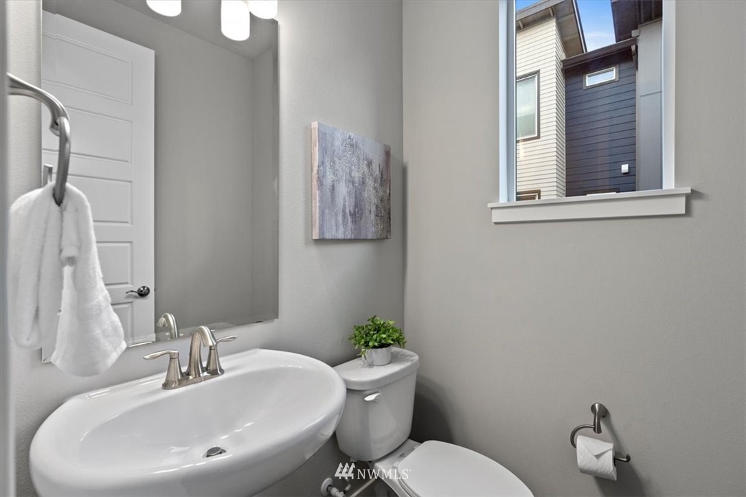 521 238th Place Southeast, Unit B Bothell, WA 98021 - Photo 13 of 21 a bathroom with a sink mirror and toilet