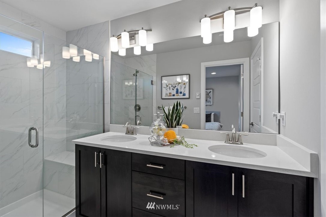 521 238th Place Southeast, Unit B Bothell, WA 98021 - Photo 18 of 21 a bathroom with a sink double vanity and a mirror