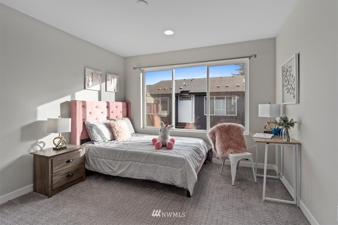521 238th Place Southeast, Unit B Bothell, WA 98021 - Photo 19 of 21 a bedroom with a bed and a window