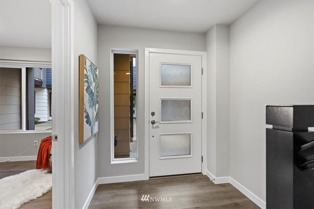 521 238th Place Southeast, Unit B Bothell, WA 98021 - Photo 3 of 21 a view of a hallway with closet and wooden floor