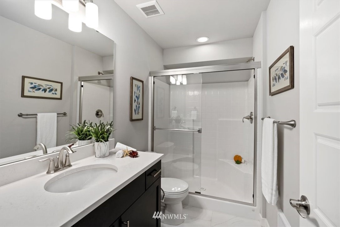 521 238th Place Southeast, Unit B Bothell, WA 98021 - Photo 5 of 21 a bathroom with a sink toilet and shower
