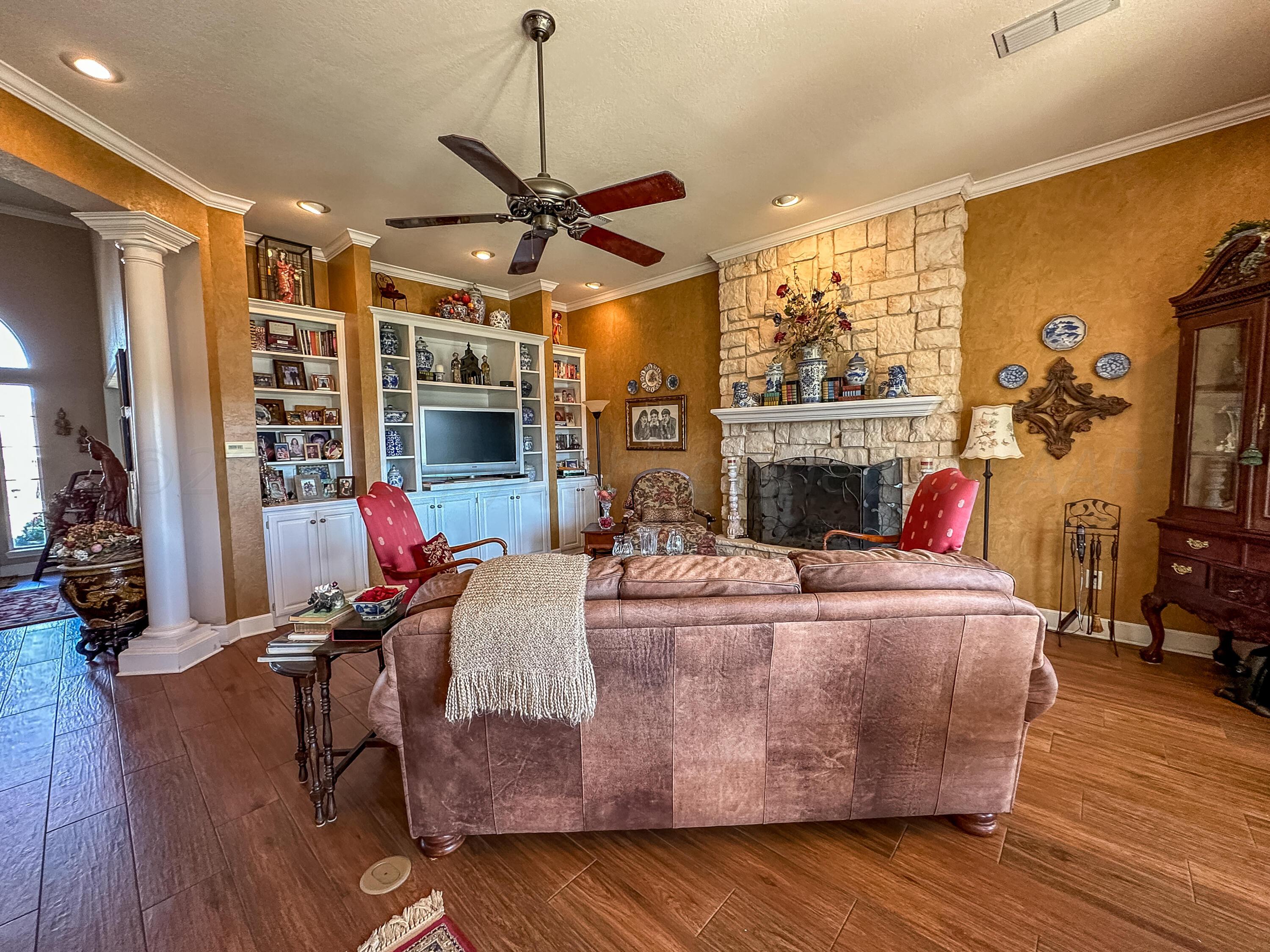 105 St James Street Borger, TX 79007 - Photo 12 of 36 a bed room with furniture and a flat screen tv
