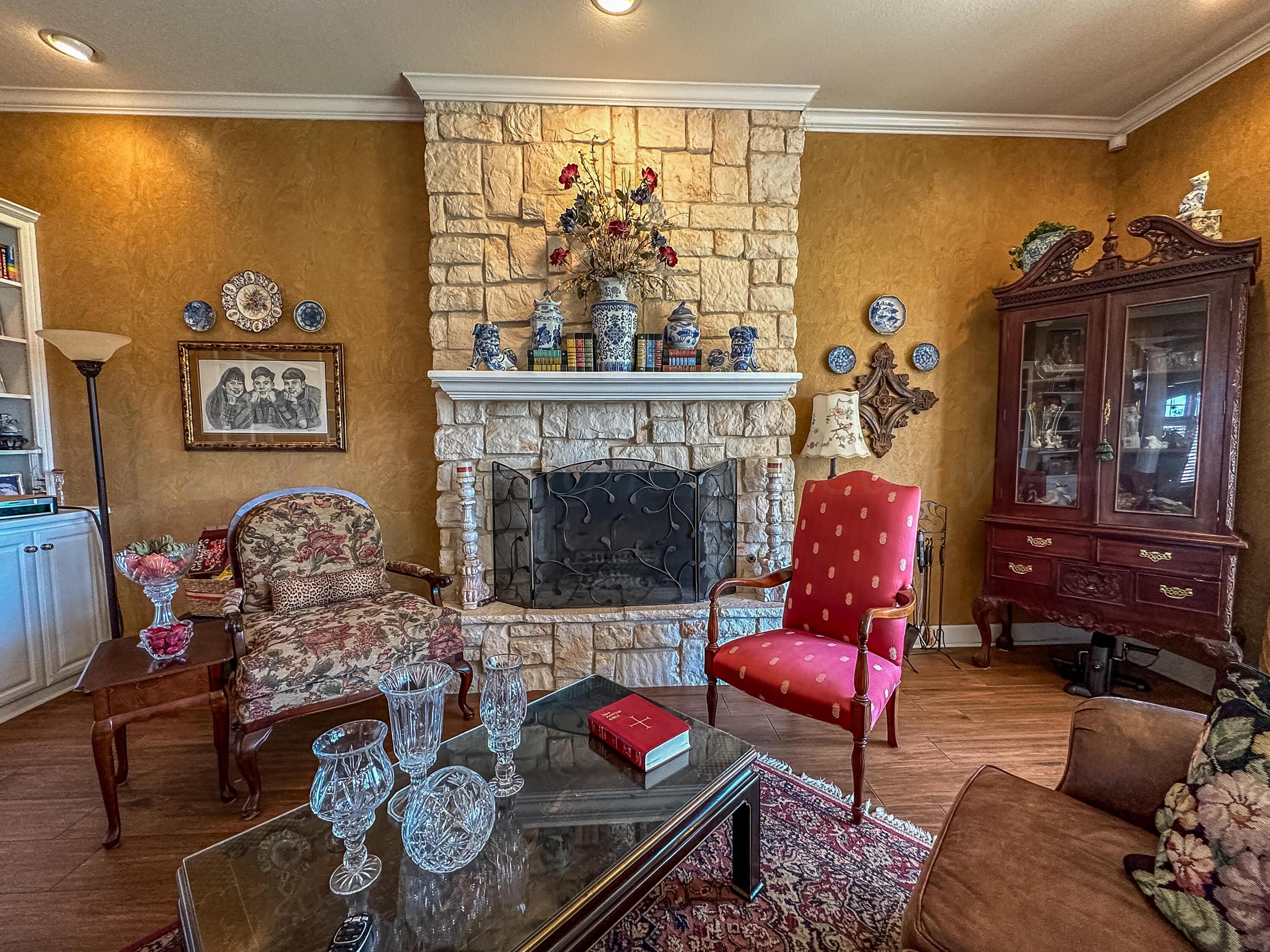 105 St James Street Borger, TX 79007 - Photo 13 of 36 a living room with furniture and a fireplace