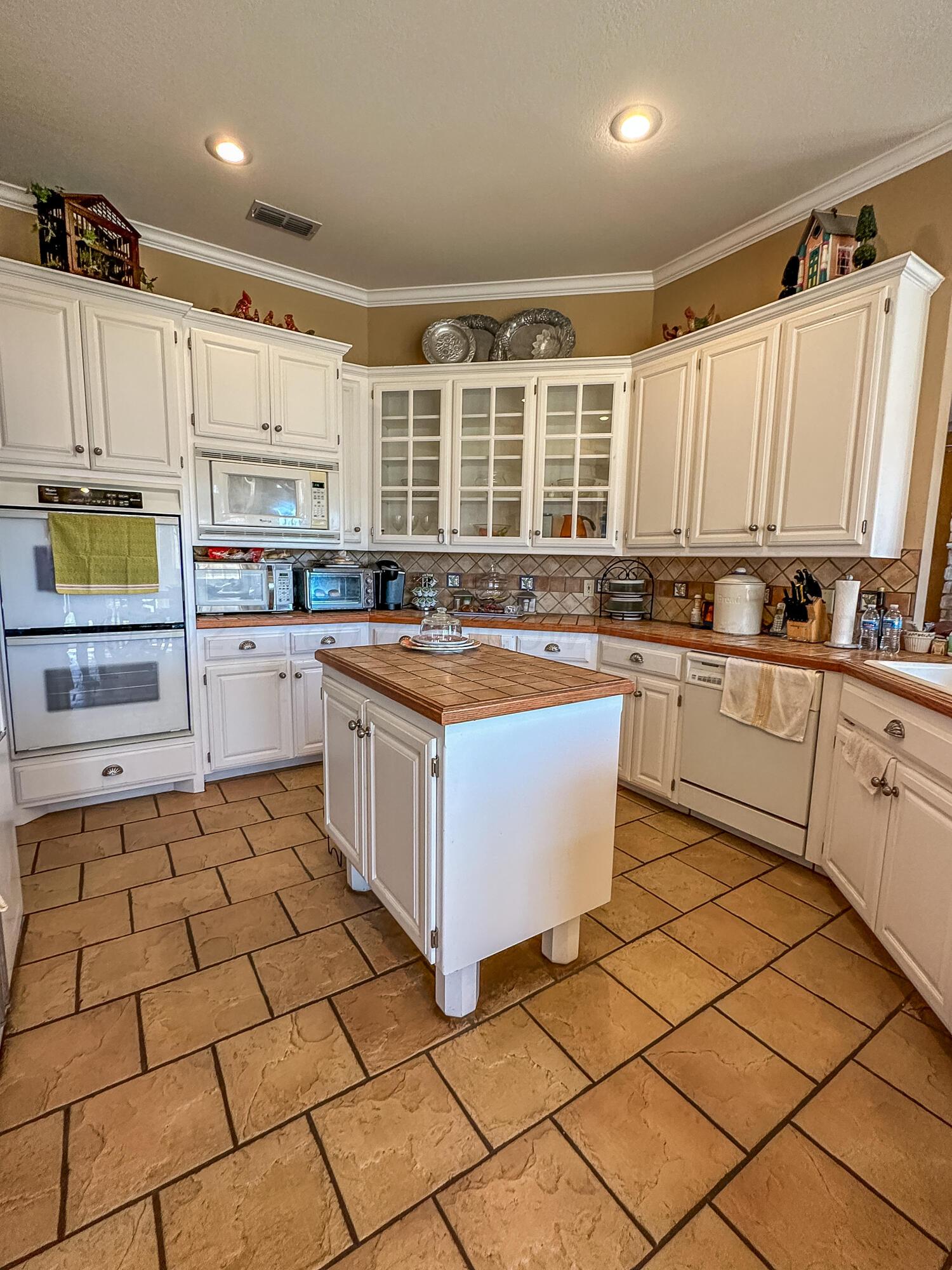 105 St James Street Borger, TX 79007 - Photo 18 of 36 a kitchen with stainless steel appliances a stove sink and cabinets
