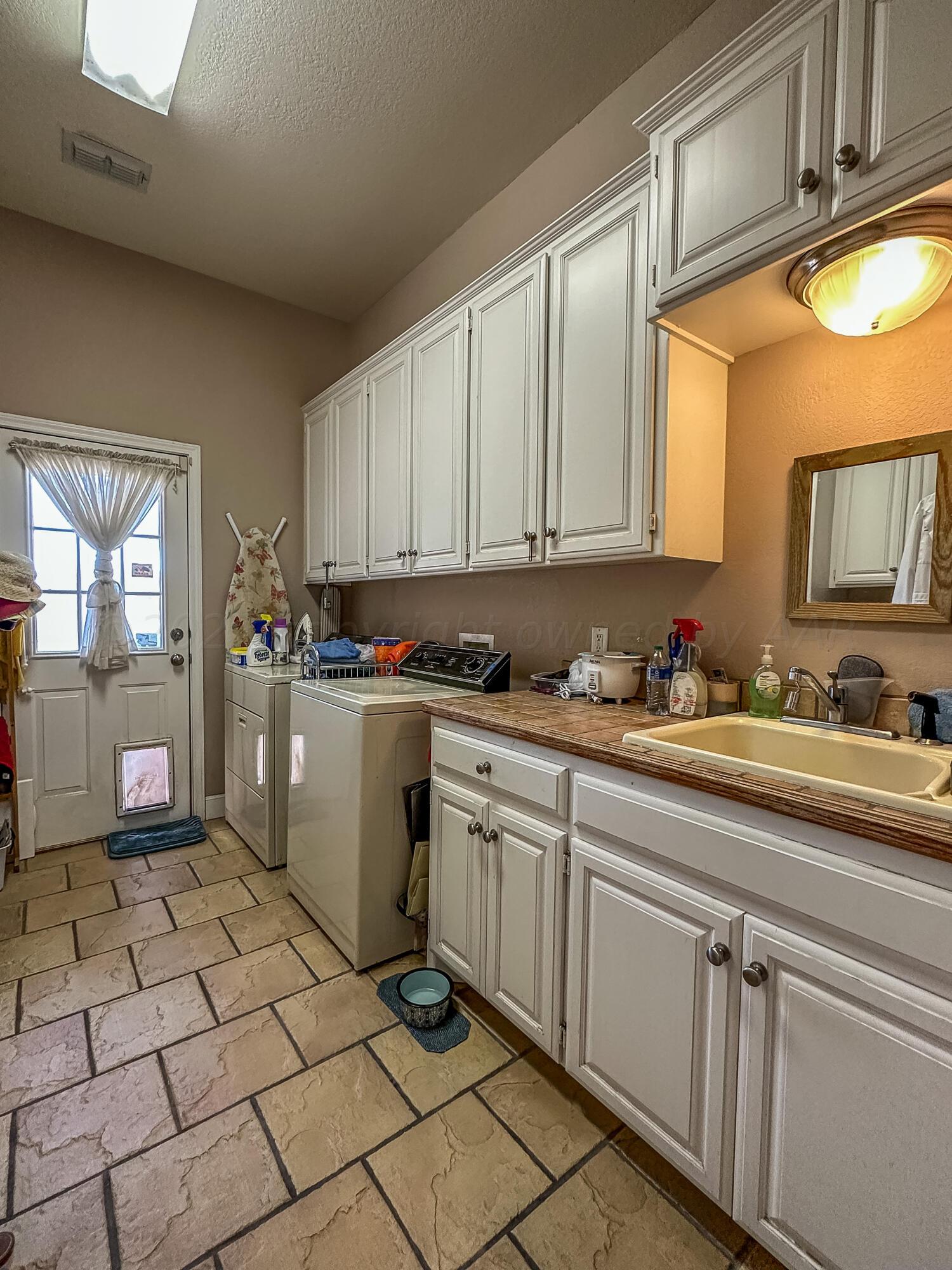 105 St James Street Borger, TX 79007 - Photo 20 of 36 a kitchen with a sink and cabinets