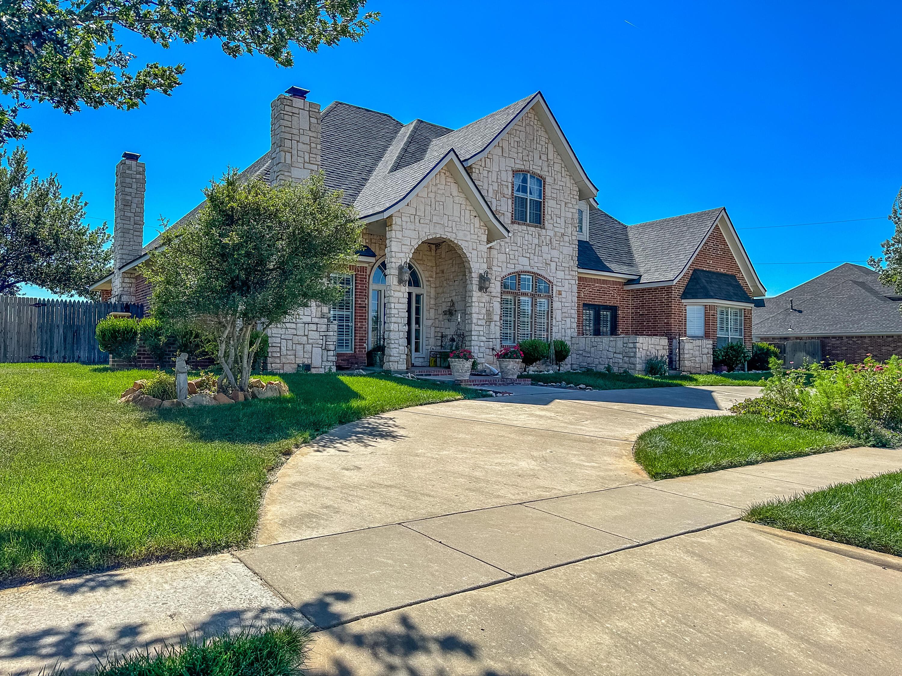105 St James Street Borger, TX 79007 - Photo 2 of 36 a front view of a house with garden
