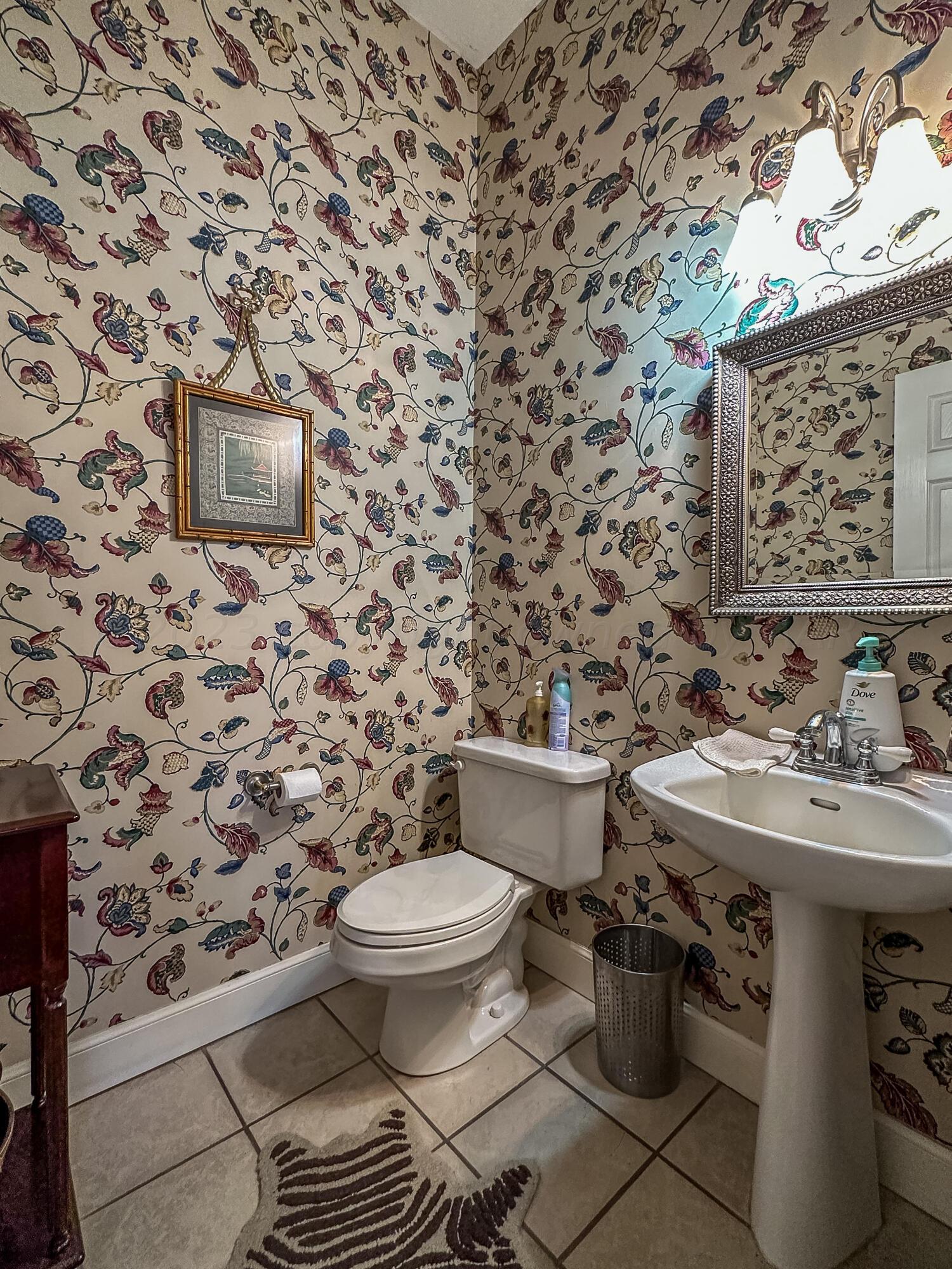 105 St James Street Borger, TX 79007 - Photo 22 of 36 a bathroom with a toilet and a sink
