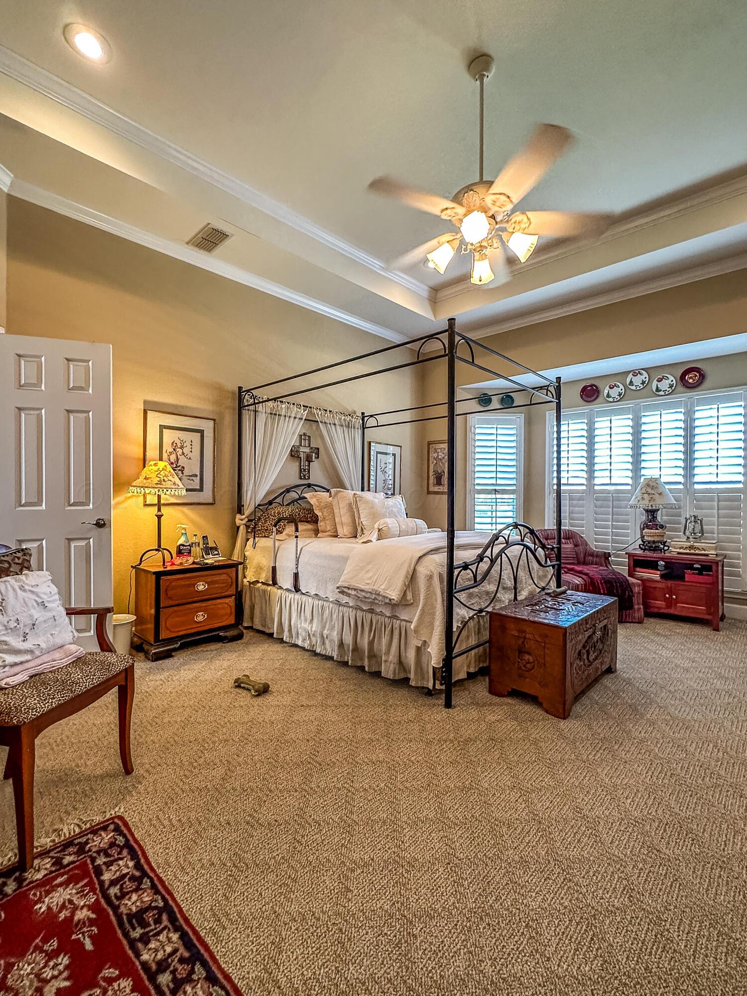 105 St James Street Borger, TX 79007 - Photo 23 of 36 a spacious bedroom with a bed and window