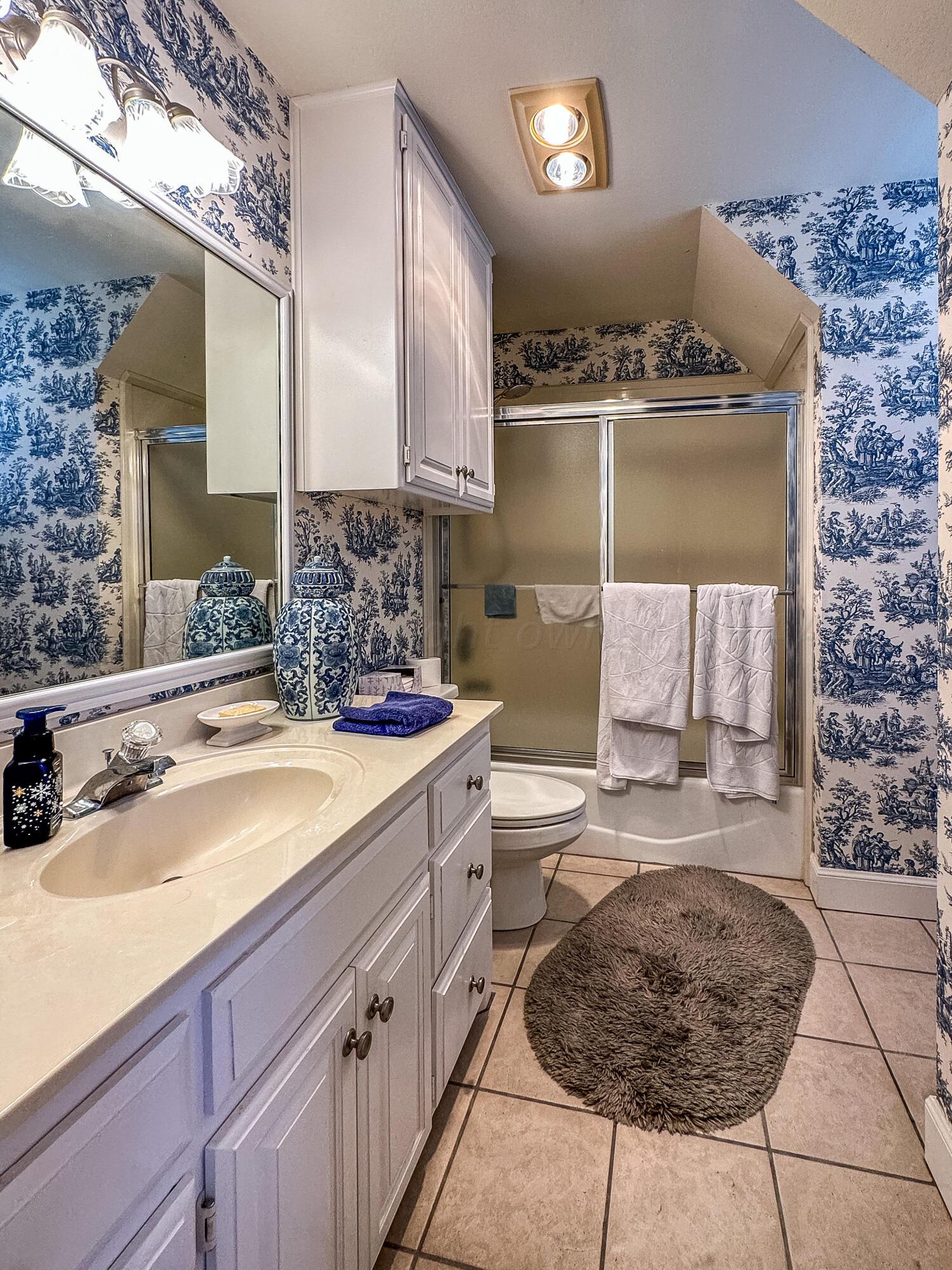 105 St James Street Borger, TX 79007 - Photo 27 of 36 a bathroom with a sink and a mirror