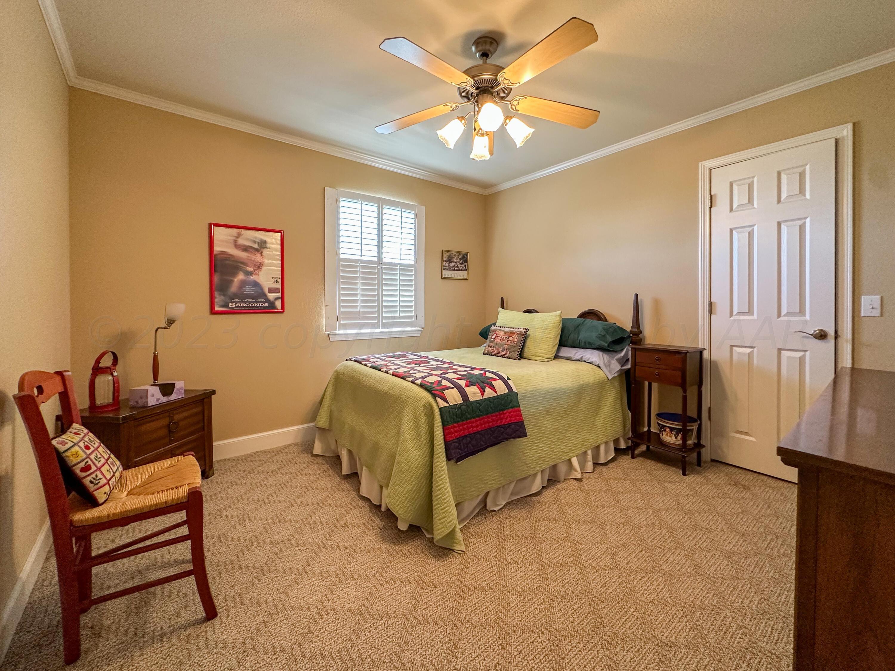 105 St James Street Borger, TX 79007 - Photo 28 of 36 a bedroom with a bed and a couch