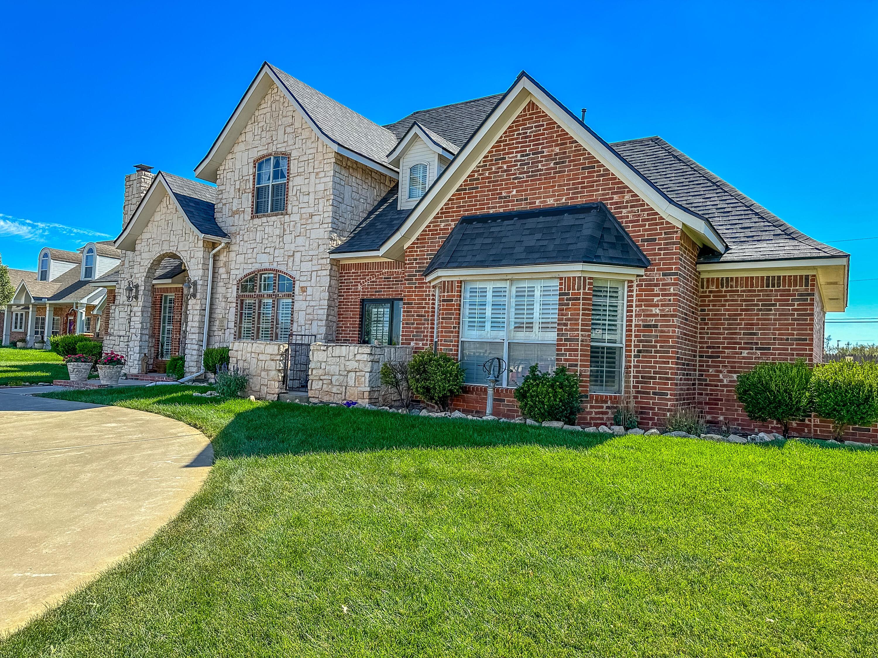 105 St James Street Borger, TX 79007 - Photo 3 of 36 a front view of a house with a yard