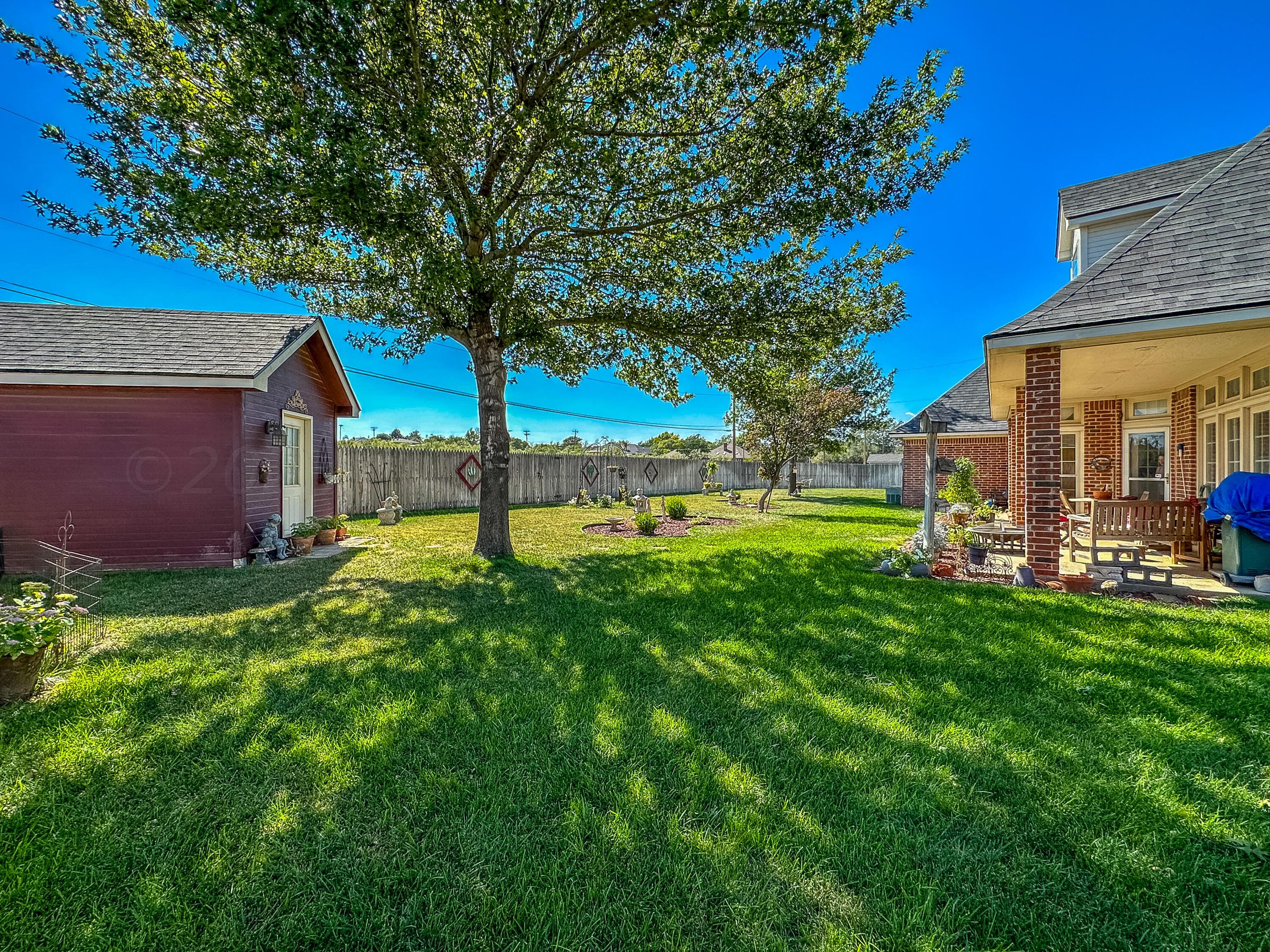 105 St James Street Borger, TX 79007 - Photo 32 of 36 a view of a house with backyard