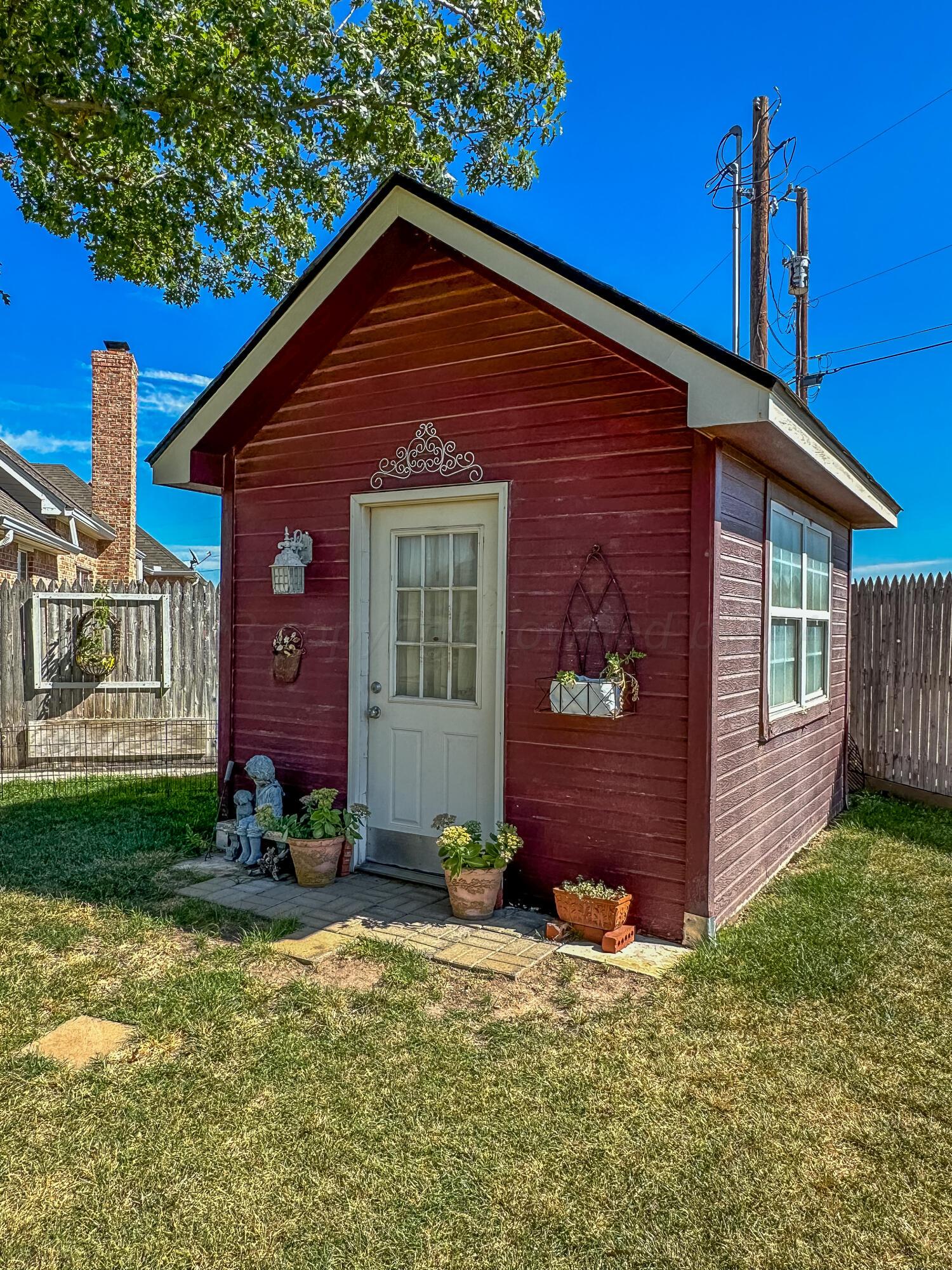 105 St James Street Borger, TX 79007 - Photo 33 of 36 a front view of a house with garden