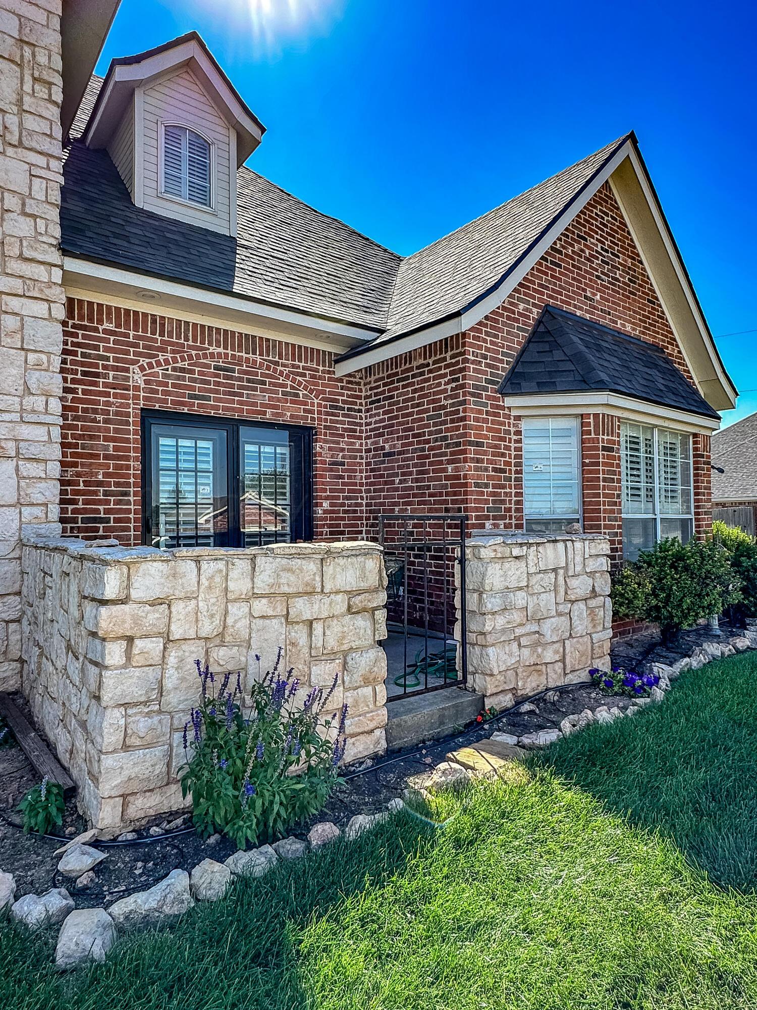 105 St James Street Borger, TX 79007 - Photo 5 of 36 a front view of a house with a garden