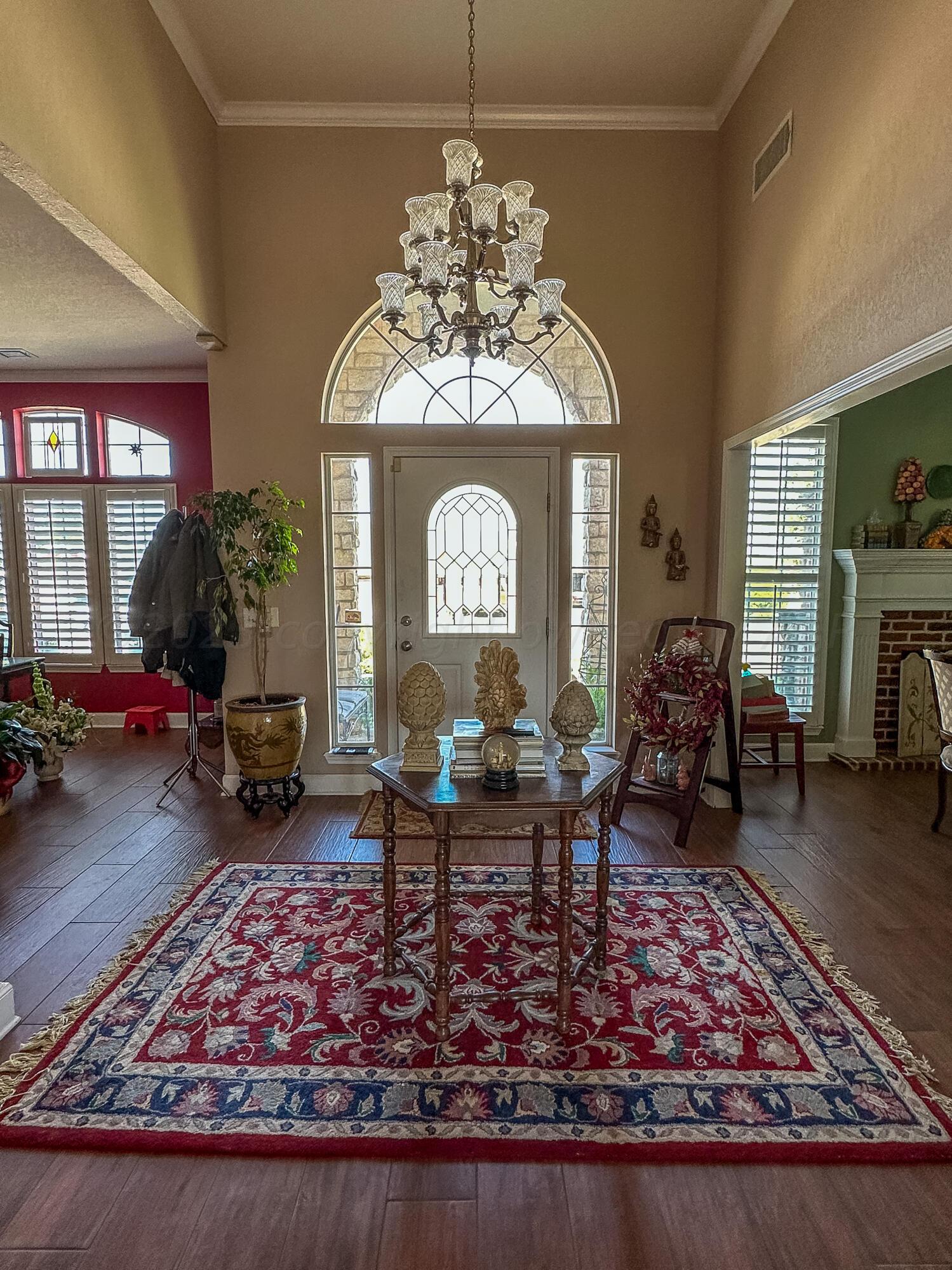 105 St James Street Borger, TX 79007 - Photo 6 of 36 a view of a dining room with furniture a chandelier and wooden floor