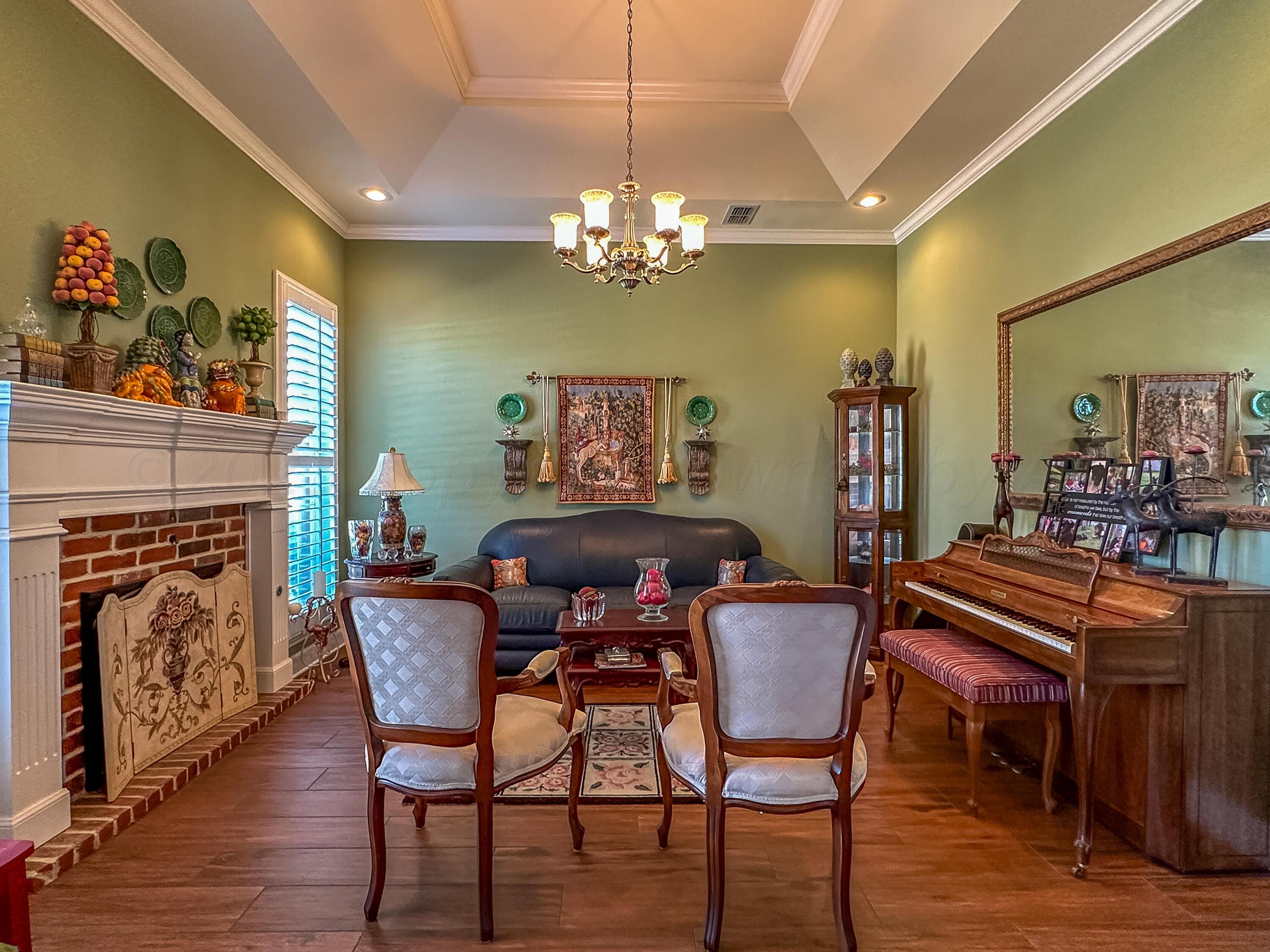 105 St James Street Borger, TX 79007 - Photo 7 of 36 a view of a dining room with furniture wooden floor and chandelier