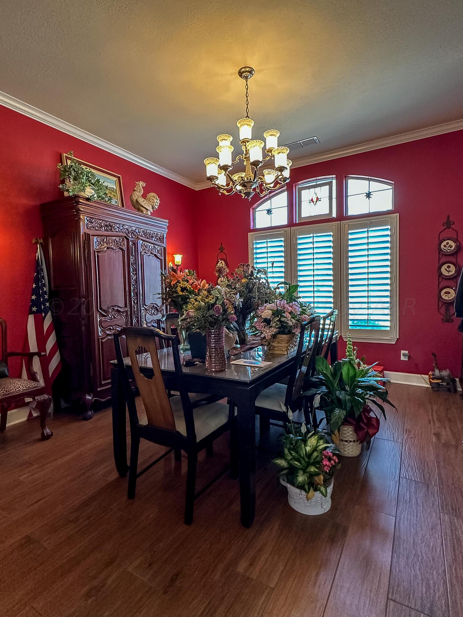 105 St James Street Borger, TX 79007 - Photo 9 of 36 a view of a dining room with furniture and chandelier
