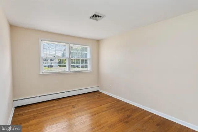 a bathroom with a sink a bathtub and window