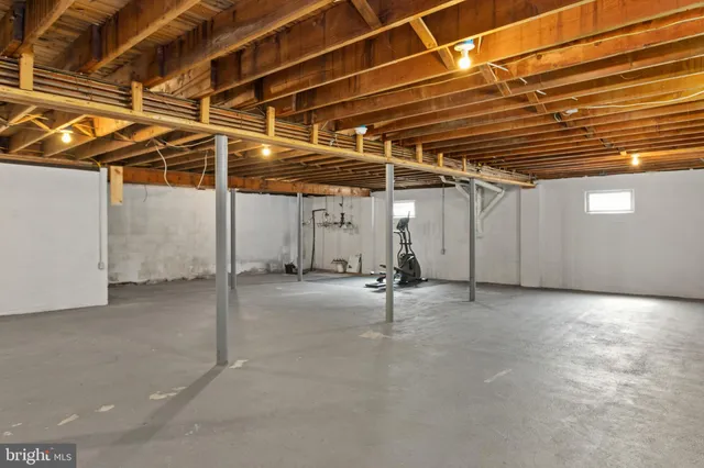 a view of empty room with wooden ceiling