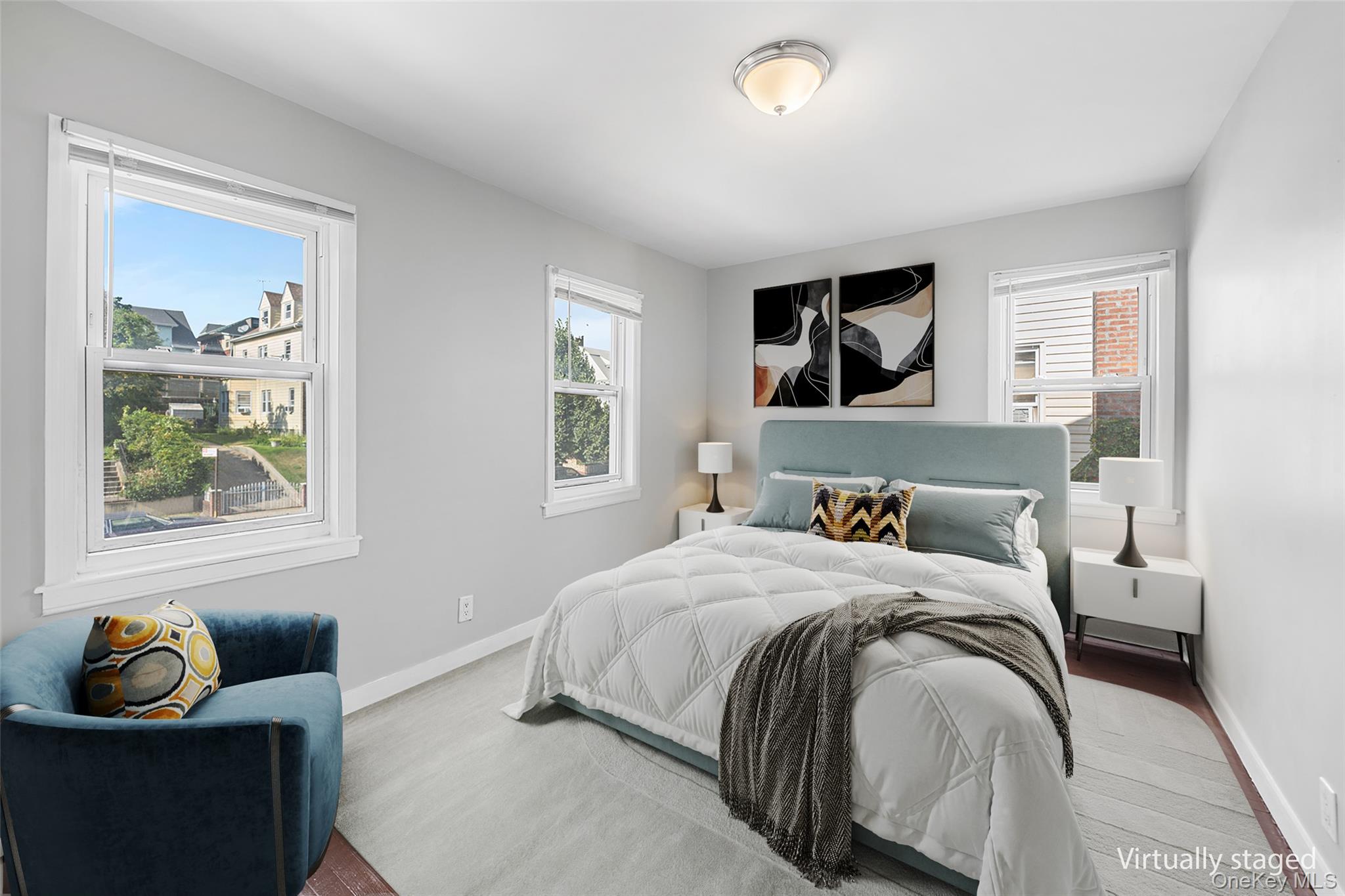 150-44 87th Road Queens, NY 11432 - Photo 20 of 35 a bedroom with a bed and a window